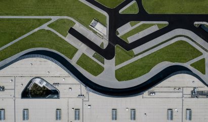 An aerial view of a curved building 