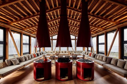 Red stoves in the pine-filled interior of Punta Chilen