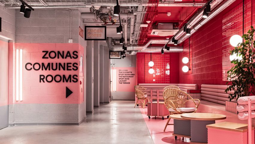 Pink walls and floors are paired with grey concrete
