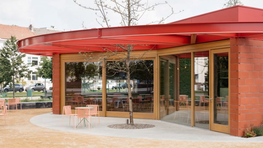 Tree growing through steel pavilion roof