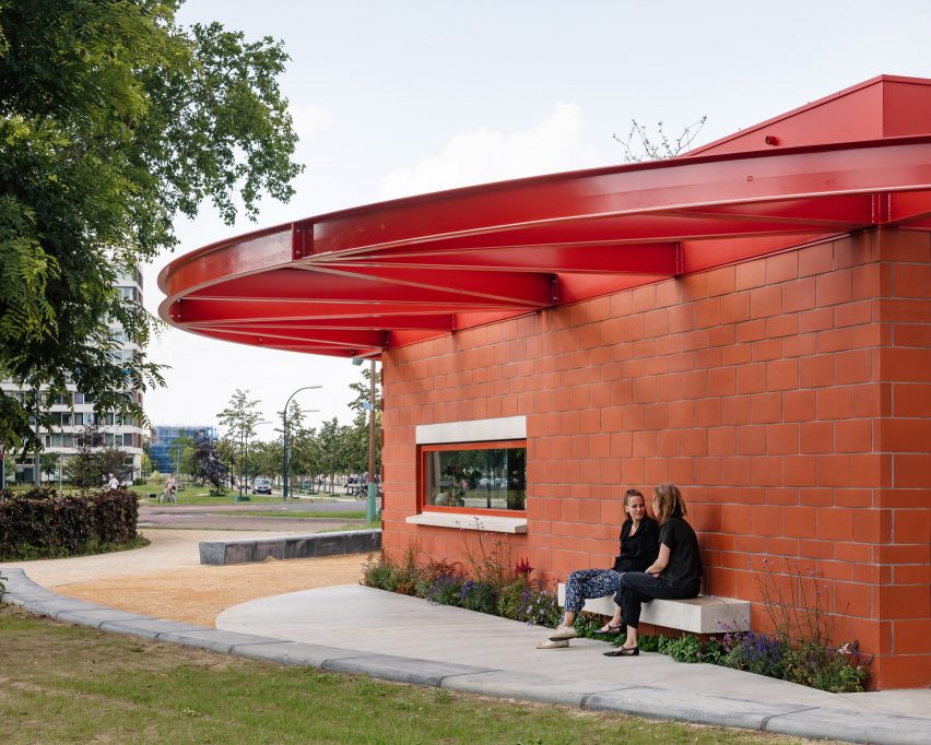 Concrete benches on red brick restaurant