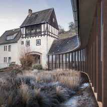 A glass-walled exhibition space at Saalecker Workshops