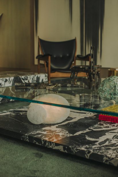 Marble and glass coffee table in AdH House living room by Simon Hamui