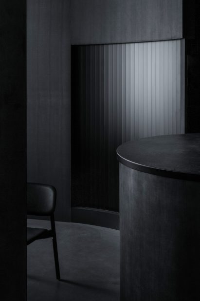 All-black interior of Tokyo restaurant by Snøhetta