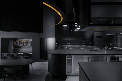 All-black open kitchen of Tokyo restaurant by Snøhetta