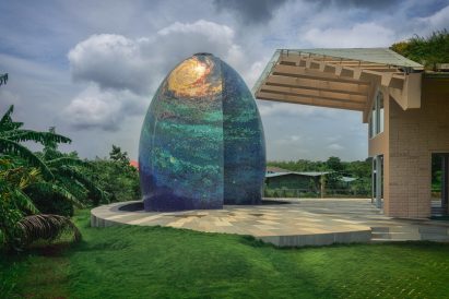 An egg-shaped temple outside an Indian house