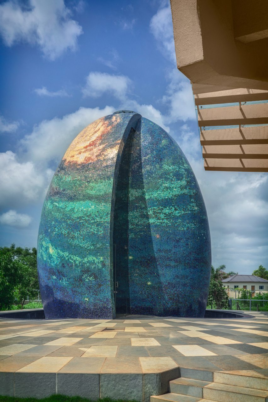 An egg-shaped temple outside an Indian house