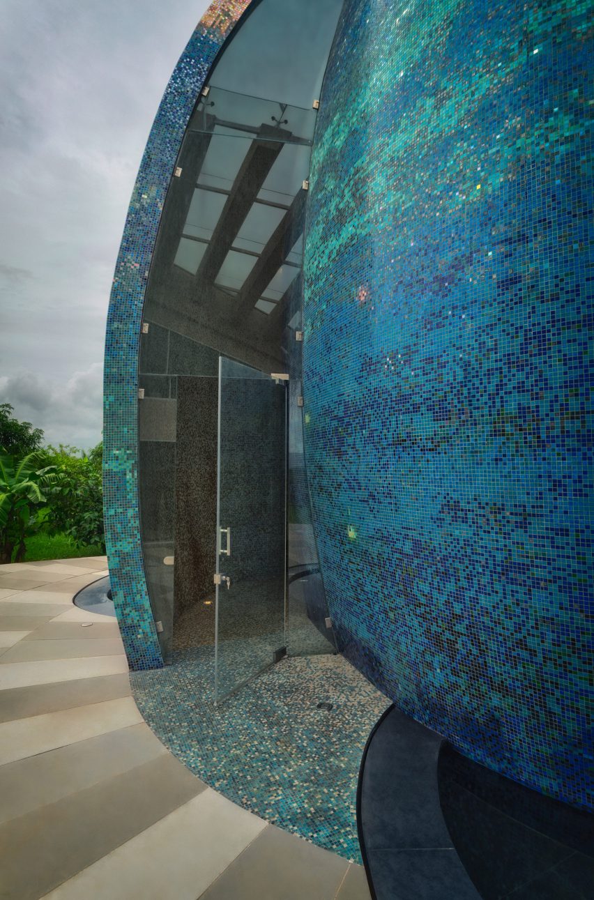 An egg-shaped temple outside an Indian house