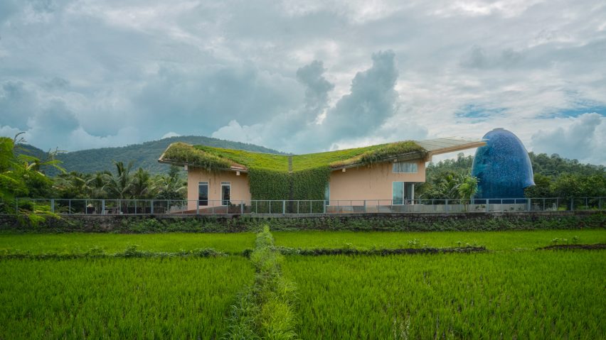 A rural Indian house with an egg-shaped temple