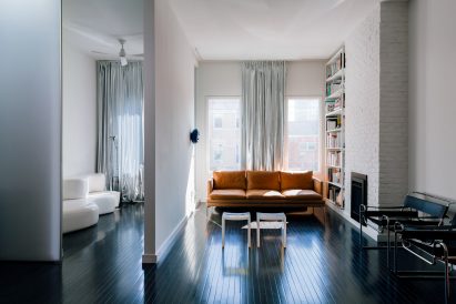 Renovated interiors including hardwood floors and exposed brick