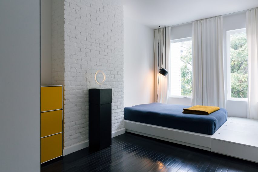 Exposed brick walls maintain a sense of the building's past