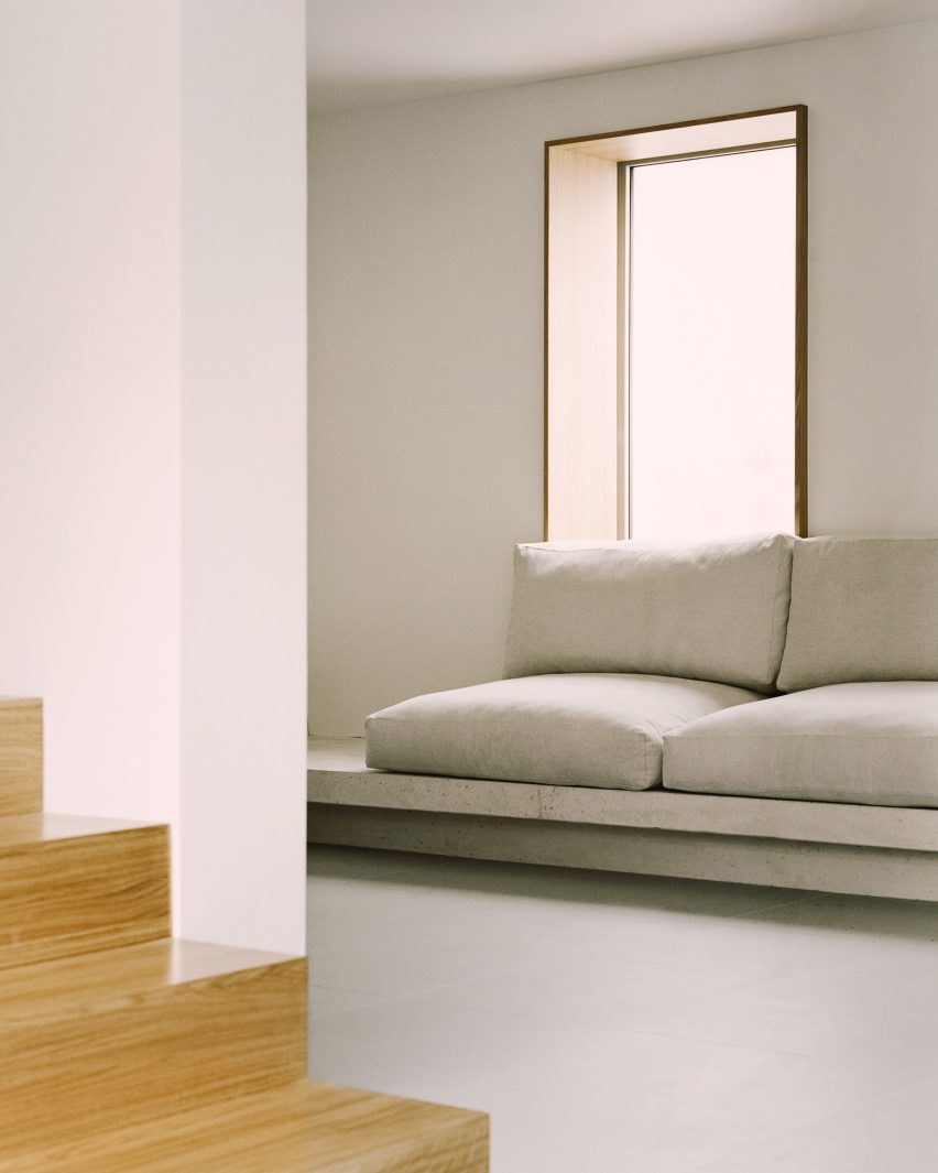 A concrete bench in the living room of a Parisian townhouse