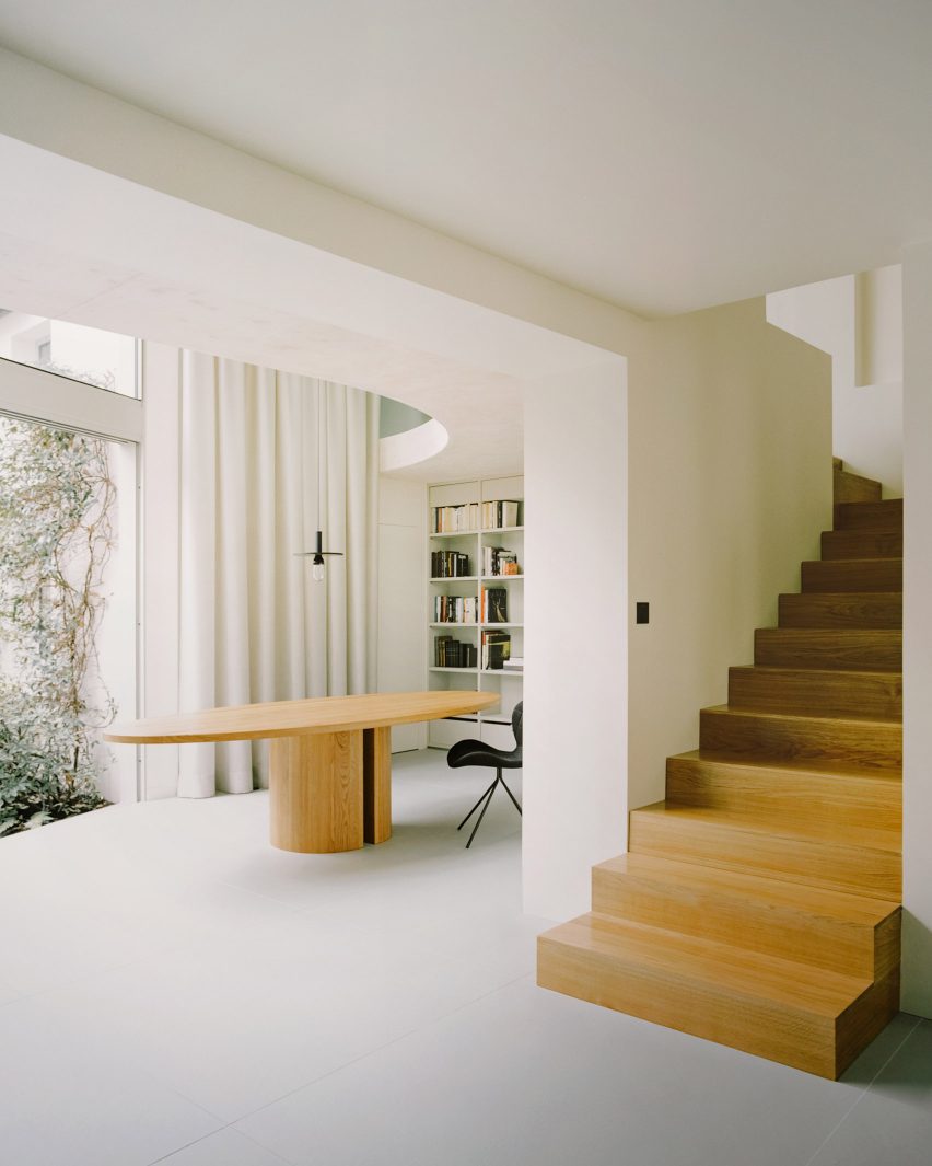 A statement wooden staircase in a Parisian townhouse by Clément Lesnoff-Rocard