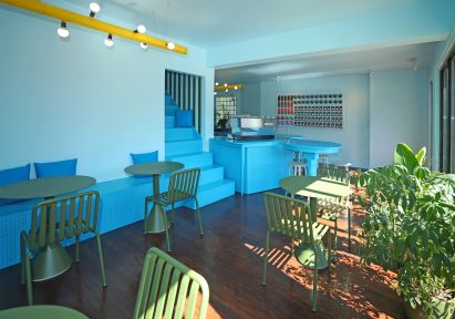 Green furniture matches with potted plants