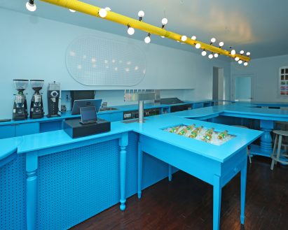 The main bar runs along one of the cafe's long walls