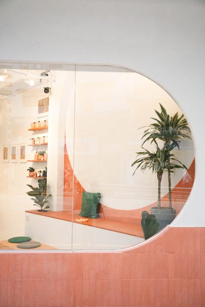 Rounded window and bench seating from cafe interior by Studio Etain Ho and Absence from Island