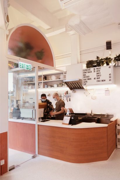 Terracotta-coloured counter of cafe by Studio Etain Ho and Absence from Island