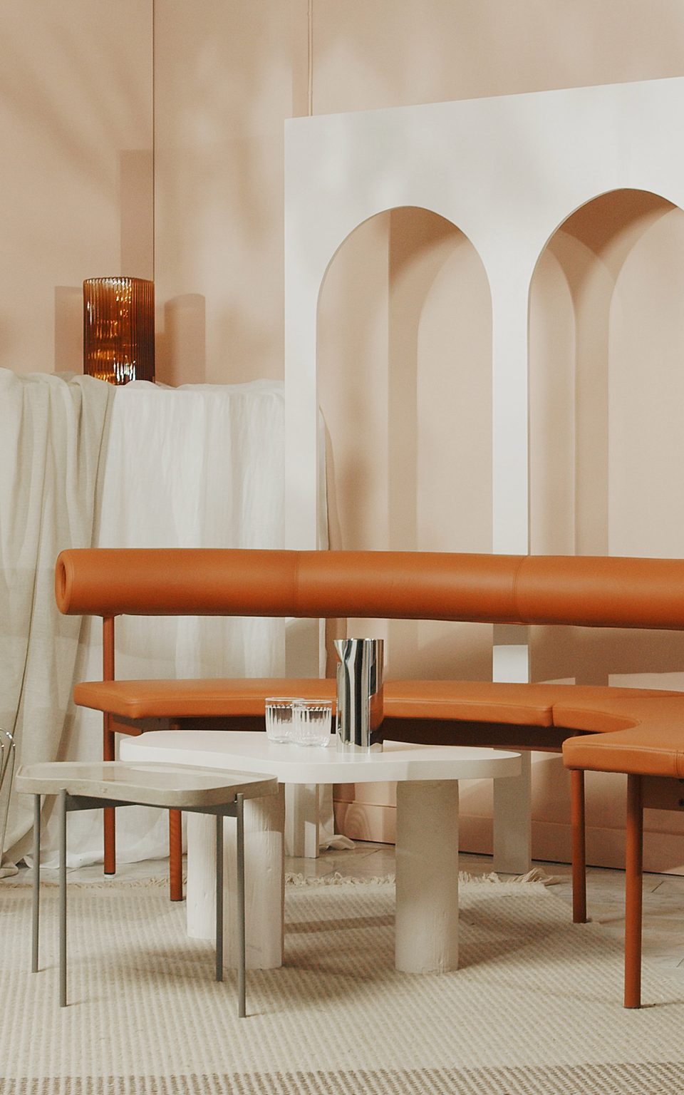 Live TV backdrop with brown leather sofa