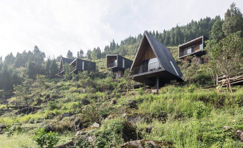 Different shaped cabins placed along a mountain terrain