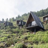 Different shaped cabins placed along a mountain terrain