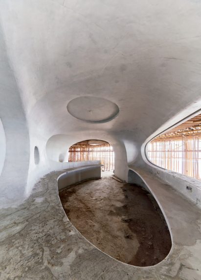 White concrete interiors of Wormhole Library