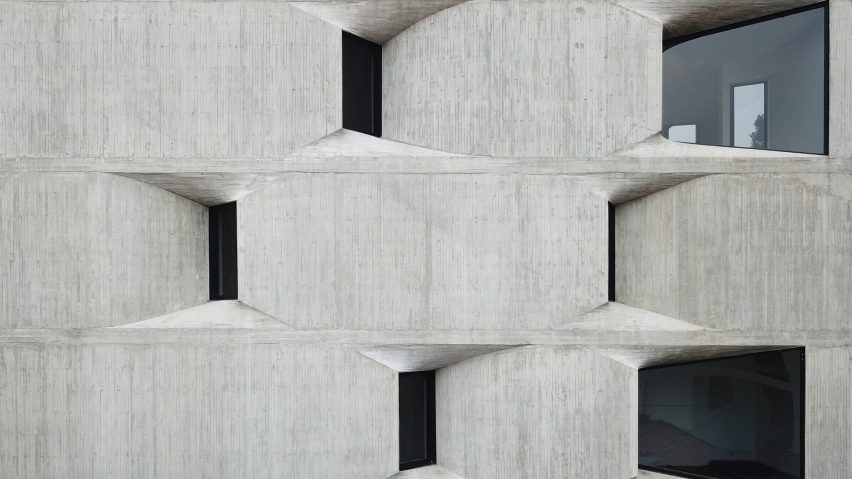Concrete wall with curved windows