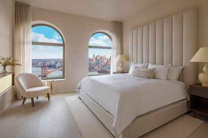 Main bedroom of model apartment in 130 William
