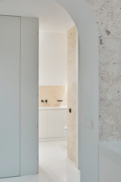 Bathroom with arched doorway in Greetings from Rome flat