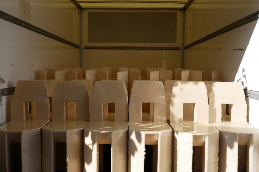 Lamb's chairs stacked up in his rented box van workshop