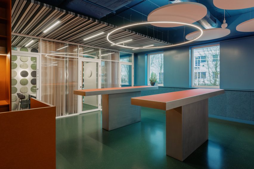 Halo lighting mimics the shape of the acoustic panels