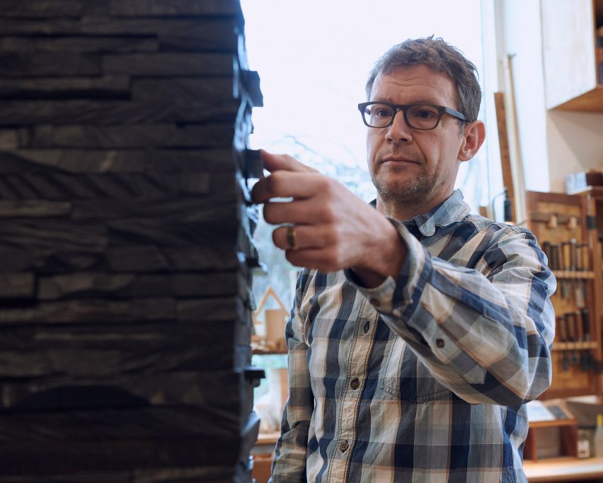Rasmus Fenhann opening a drawer in the Ebano cabinet