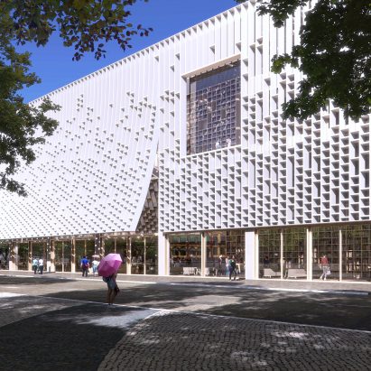 The facade is a bright white and has large windows by Mecanoo