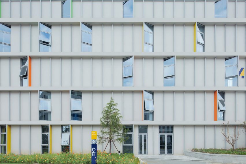 Angled windows cover the facade