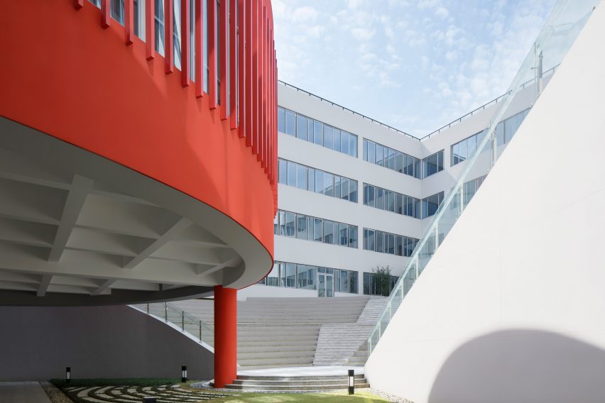 Red library hovers over the courtyard