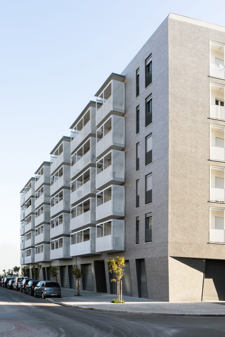 The building has a grey brick facade