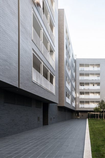 Dark grey tiling extends through the courtyard