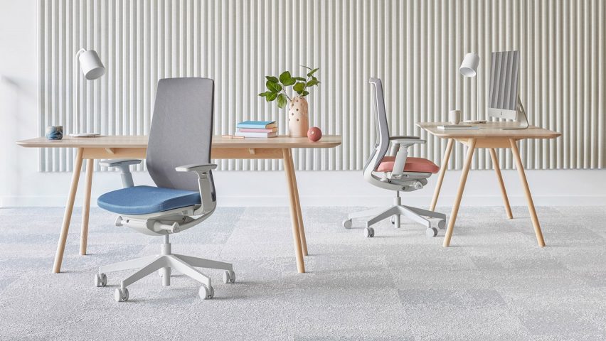 An office featuring two desks and chairs with mesh backrests by Flokk