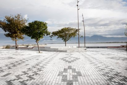 A decorative waterfront plaza in Shiroka