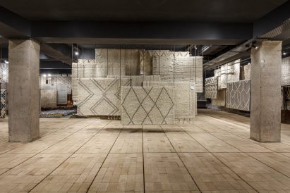 Pale firebrick covers the floors by Architecture Discipline