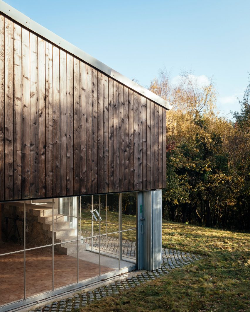 The wood and glass exterior of a converted barn