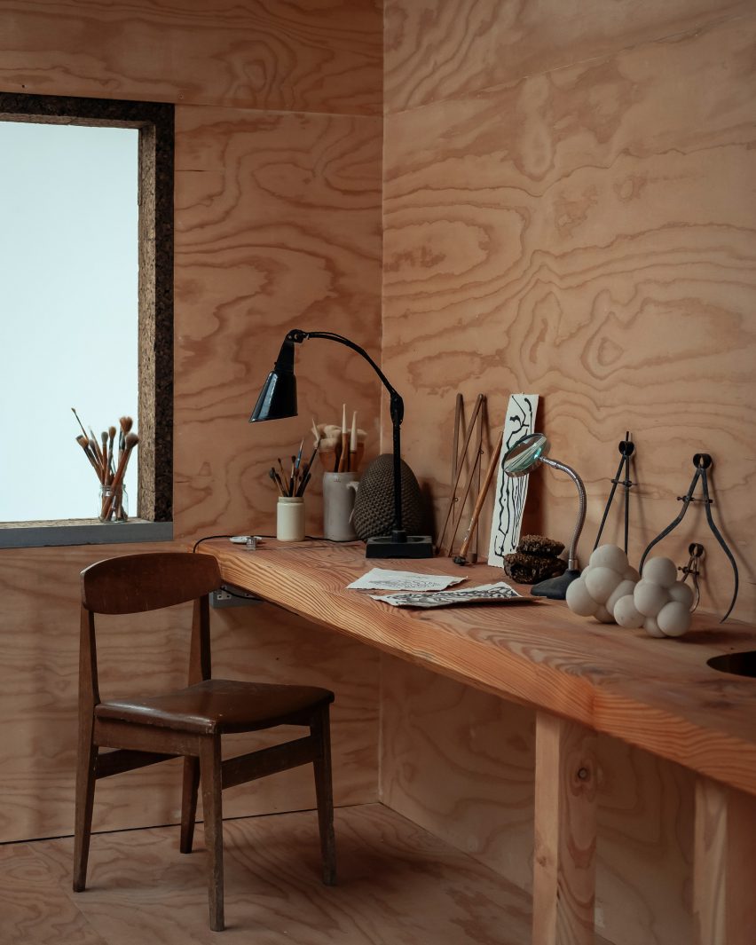 A wood-lined art studio