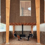 A cork-clad studio and seating area