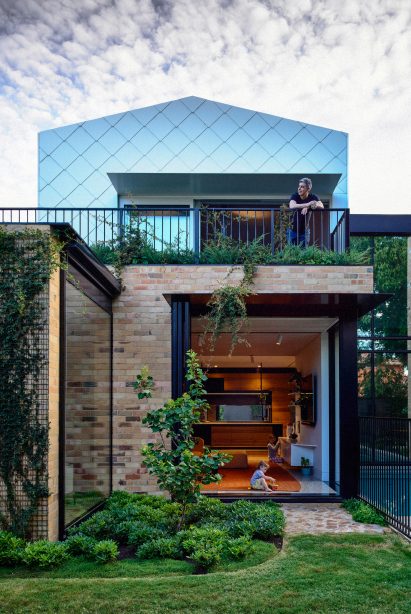 Bifold doors extend the living space into the garden by Austin Maynard Architects