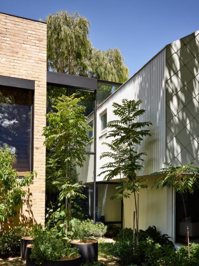 Recycled brick and steel shingles are combined