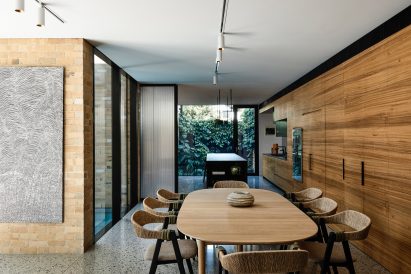 Open plan kitchen diner with wood interiors by Austin Maynard Architects