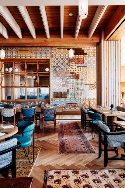Peacock restaurant with tiled wall in Austin hotel