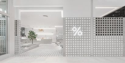 Entrance to % Arabica Bangkok location with perforated brick wall