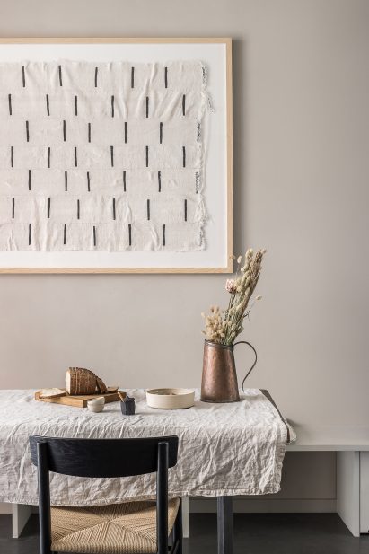 Minimalist dining room with linen tablecloth