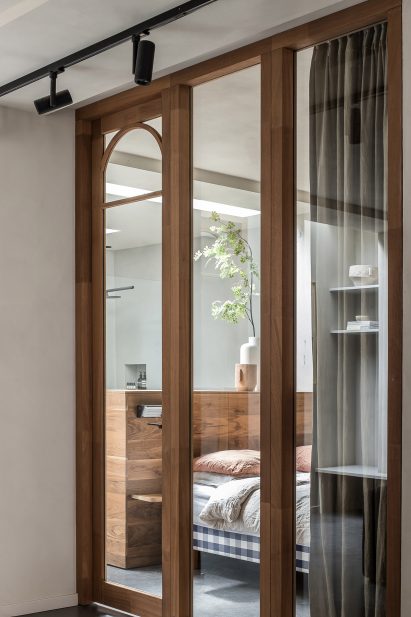 Arched wooden door and window frames inspired by art deco