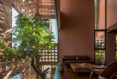 A tree top is viewable from the interior 
